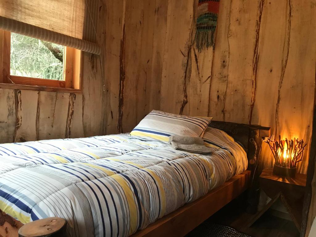 Voodi või voodid majutusasutuse Karkú Lodge toas