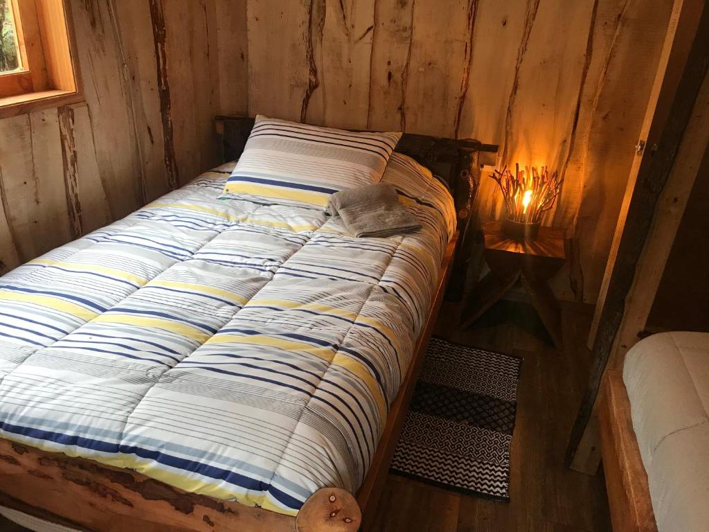 Voodi või voodid majutusasutuse Karkú Lodge toas