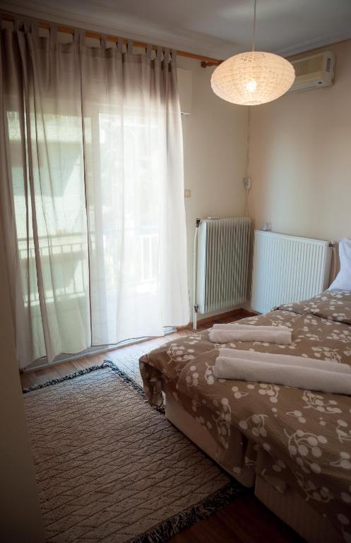 Posteľ alebo postele v izbe v ubytovaní Paradise View Apartment