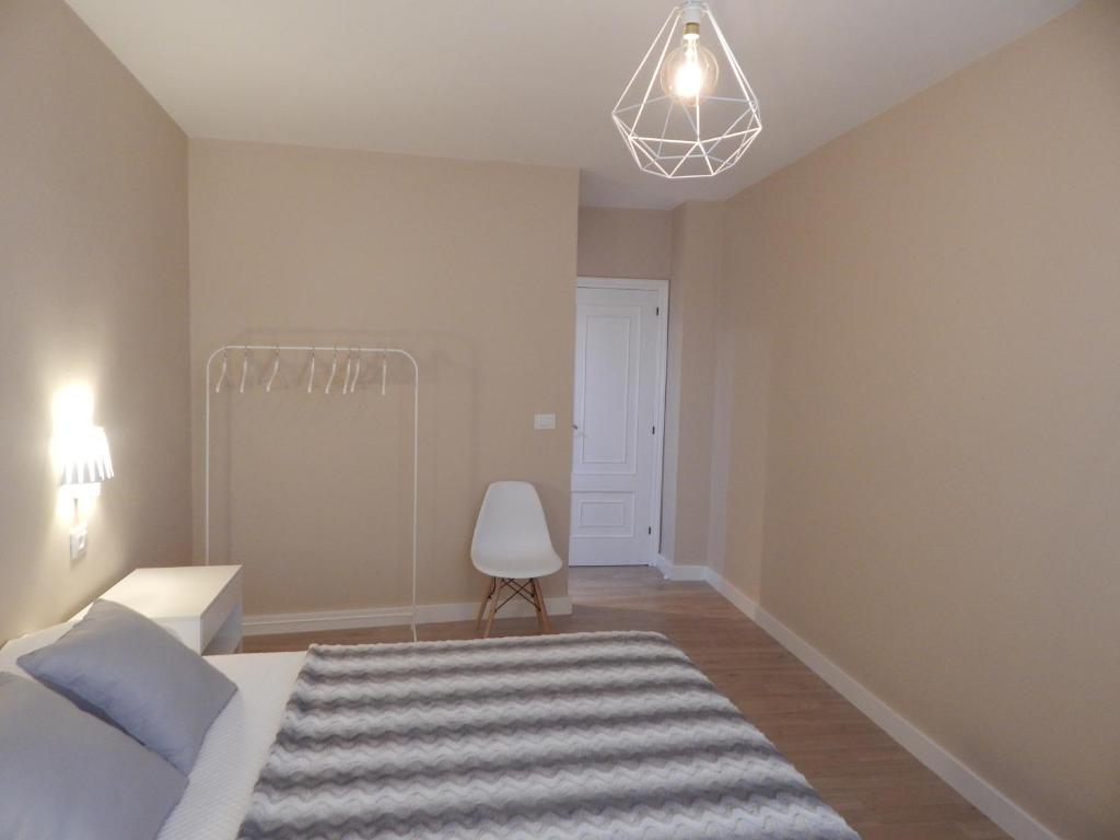 Łóżko lub łóżka w pokoju w obiekcie CORAL HOME