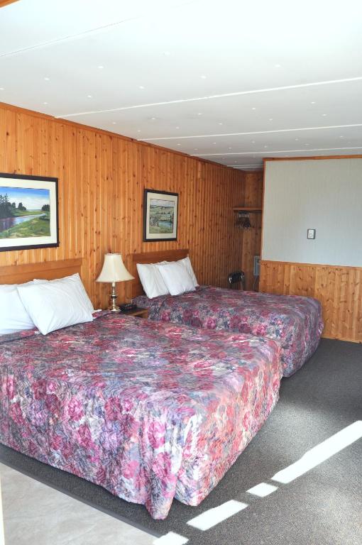 Postel nebo postele na pokoji v ubytování Bay Vista Motel