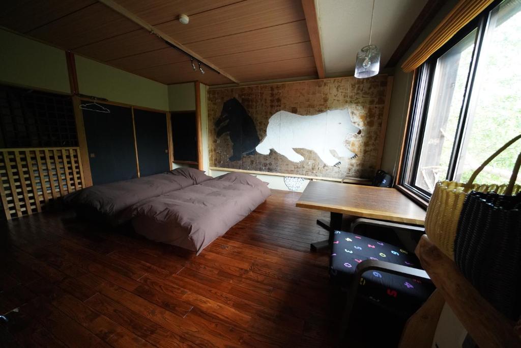 Postel nebo postele na pokoji v ubytování ARtINn 極寒藝術伝染装置