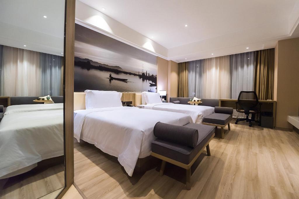 Postelja oz. postelje v sobi nastanitve Atour Hotel (Zhuji Xishi Hometown)