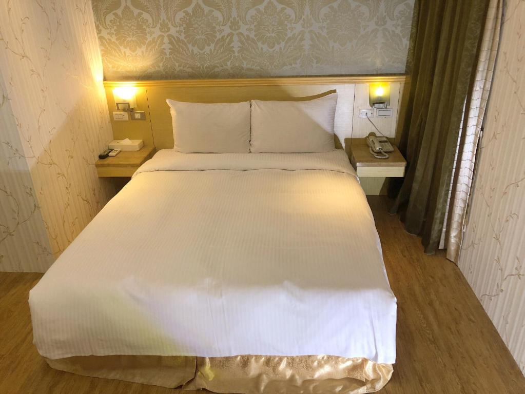 Postel nebo postele na pokoji v ubytování Say Love Hotel
