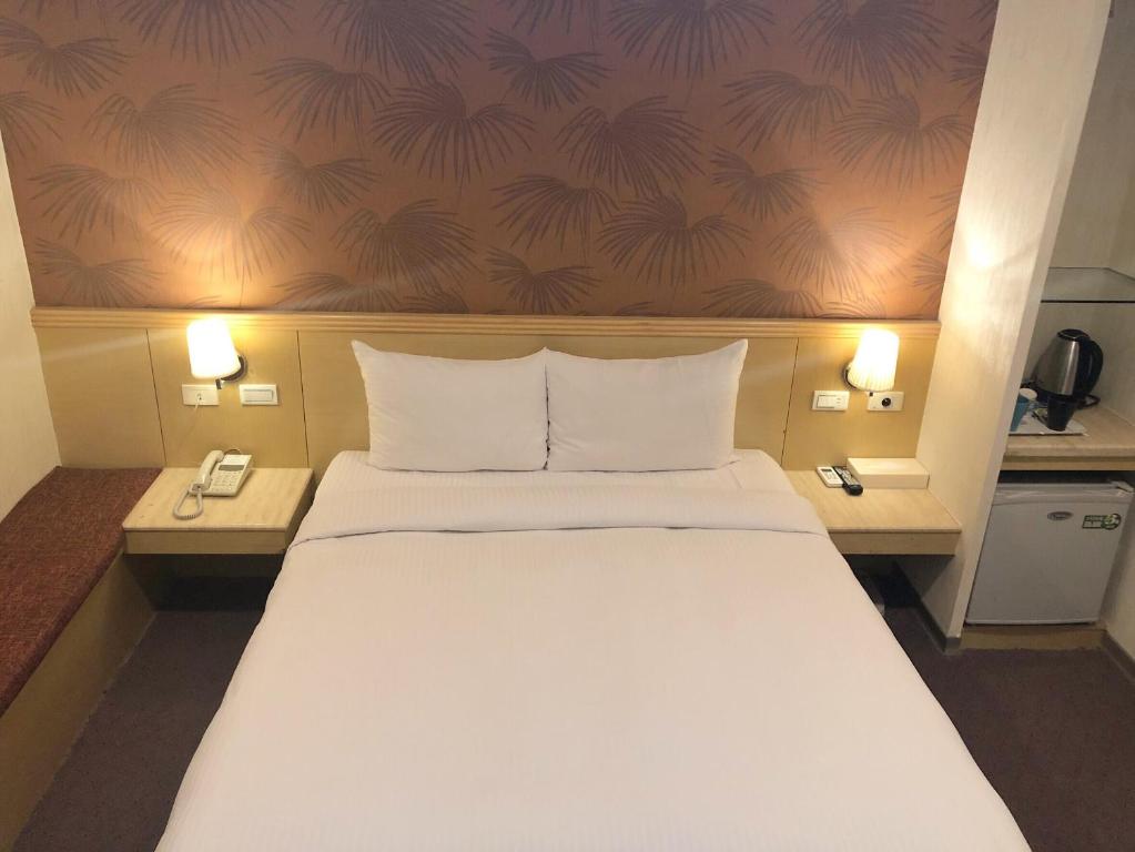 Postel nebo postele na pokoji v ubytování Say Love Hotel