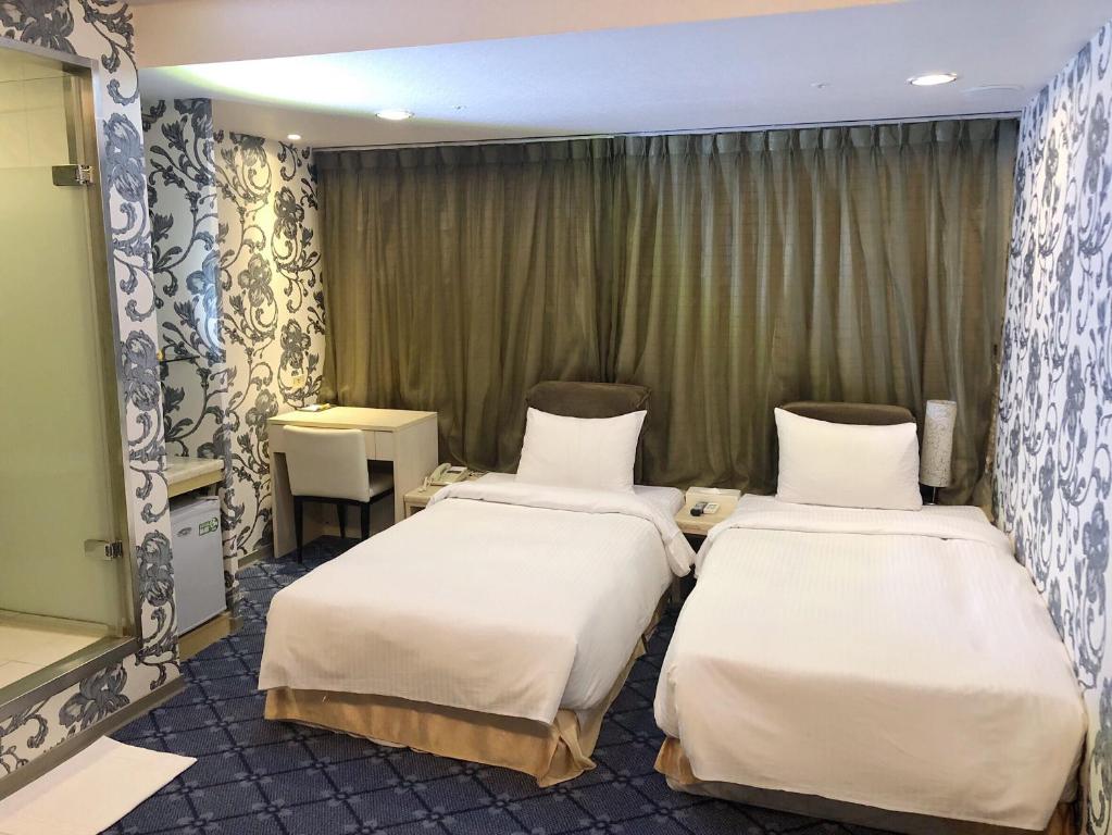 Postel nebo postele na pokoji v ubytování Say Love Hotel