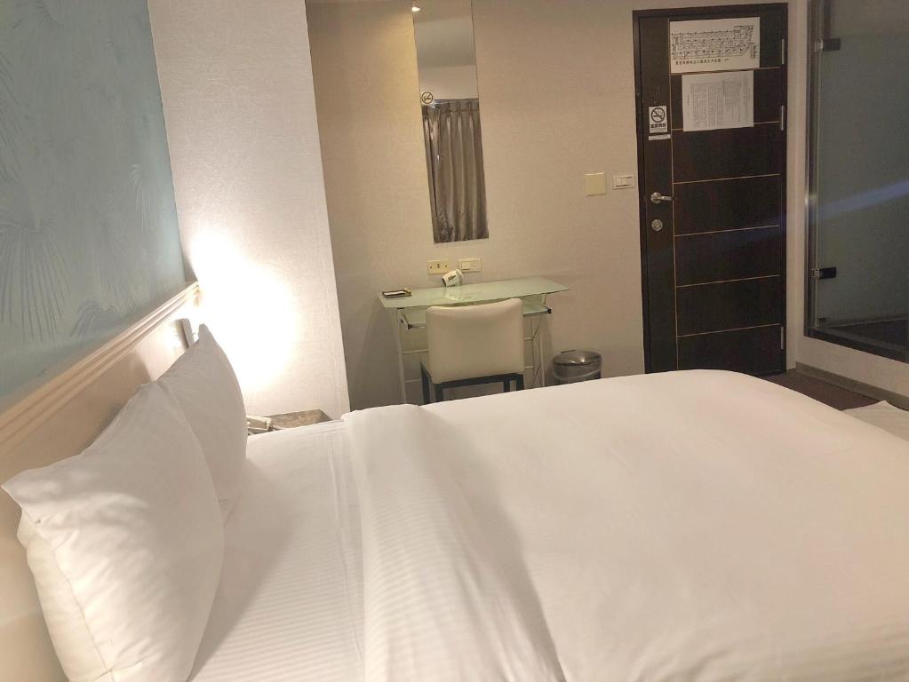 Postel nebo postele na pokoji v ubytování Say Love Hotel