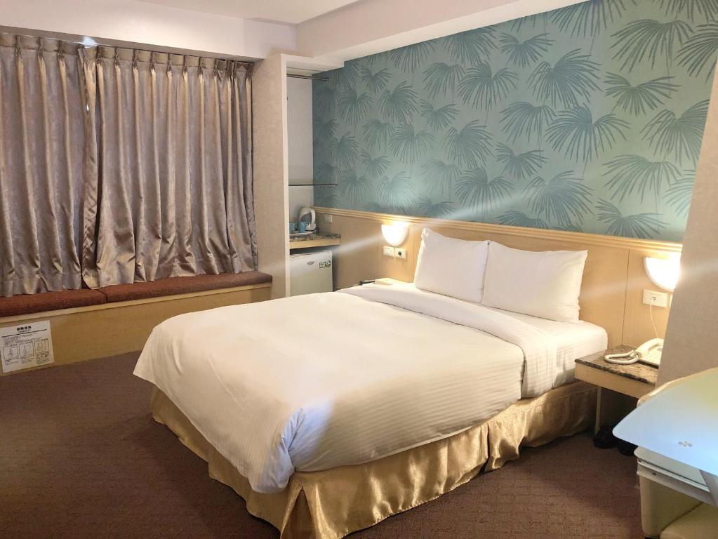 Postel nebo postele na pokoji v ubytování Say Love Hotel