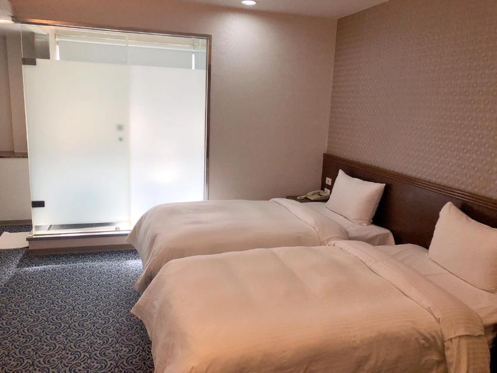 Postel nebo postele na pokoji v ubytování Say Love Hotel