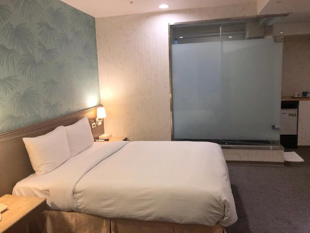 Postel nebo postele na pokoji v ubytování Say Love Hotel