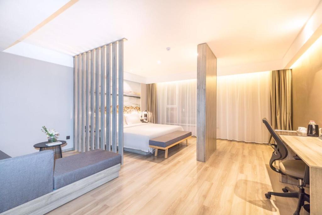 Postel nebo postele na pokoji v ubytování Atour Hotel Qingdao Airport Chengyang Wanxianghui