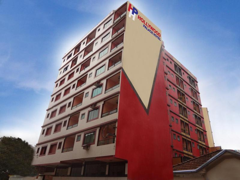 a tall building with a large lettering on it at Hollywood Palace Hotel in Aparecida