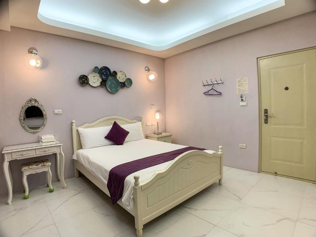 Postel nebo postele na pokoji v ubytování Hualien Dawan B&B