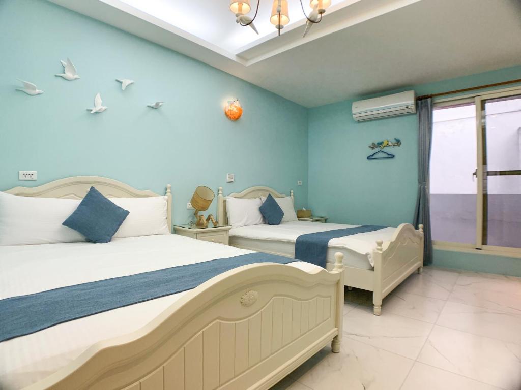 Postel nebo postele na pokoji v ubytování Hualien Dawan B&B