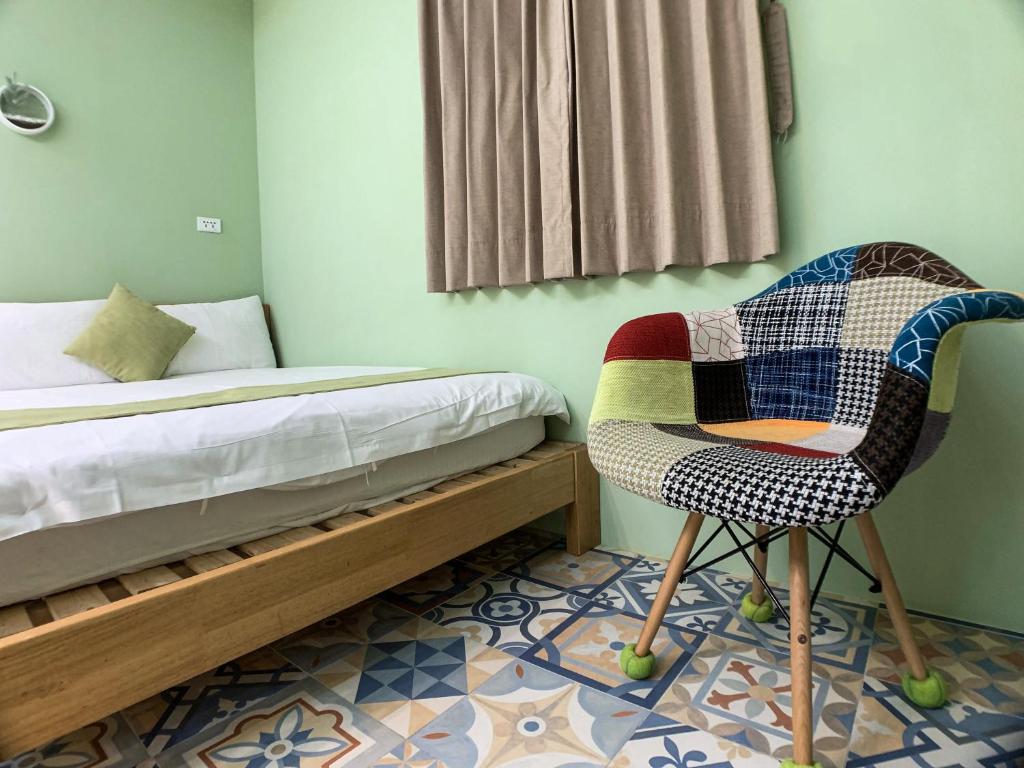 Postel nebo postele na pokoji v ubytování Hualien Dawan B&B