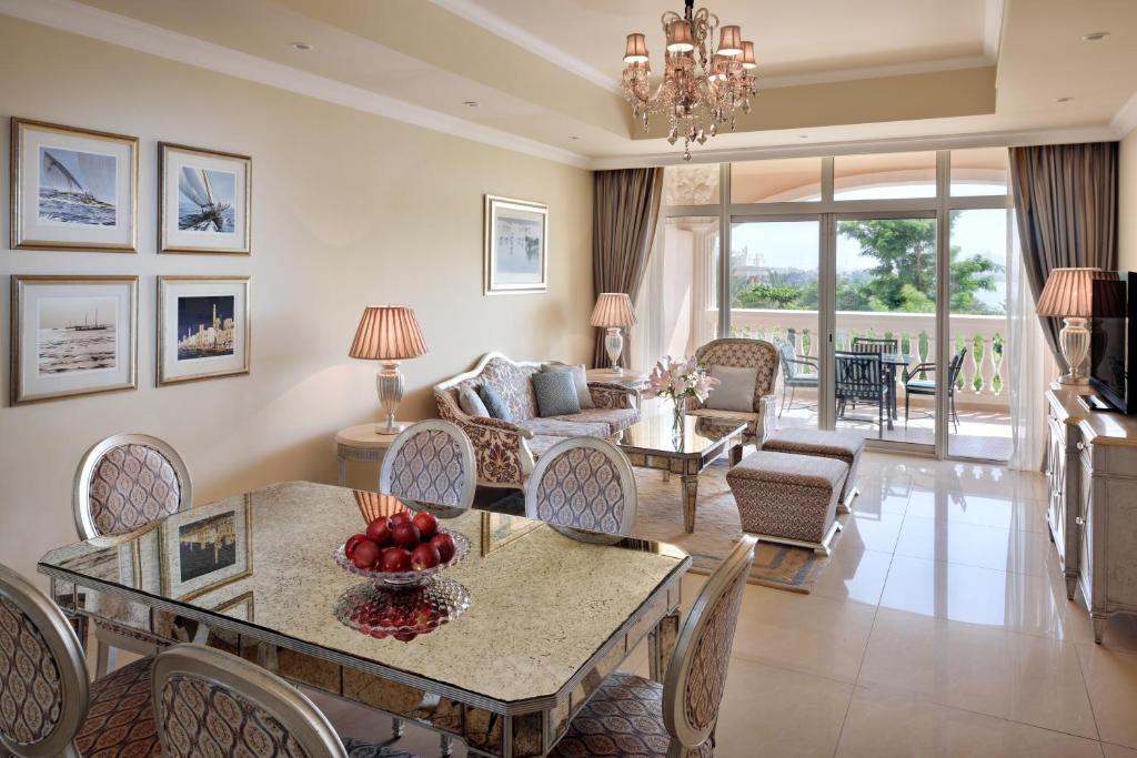 a living room with a table with fruit on it at Kempinski Hotel Palm Jumeirah in Dubai