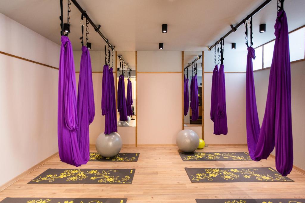 a yoga room with purple curtains and yoga mats at Balos Beach in Kissamos