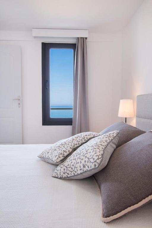 Postel nebo postele na pokoji v ubytování Kimata Apartments