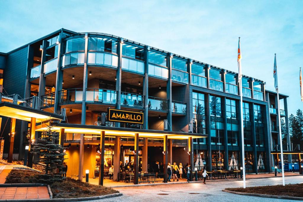 a large building with a sign in front of it at Break Sokos Hotel Vuokatti in Vuokatti