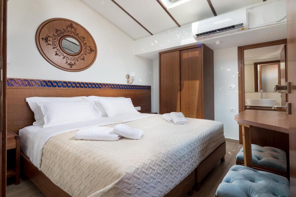 Łóżko lub łóżka w pokoju w obiekcie Vener Luxury Suites