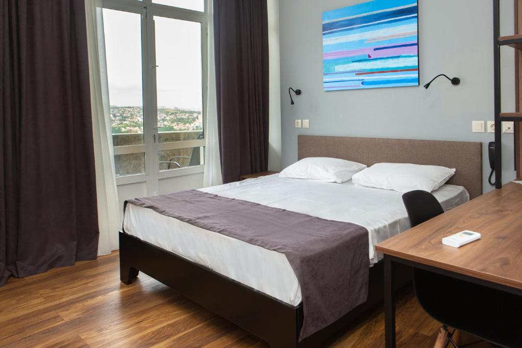 Postel nebo postele na pokoji v ubytování Vista Hotel