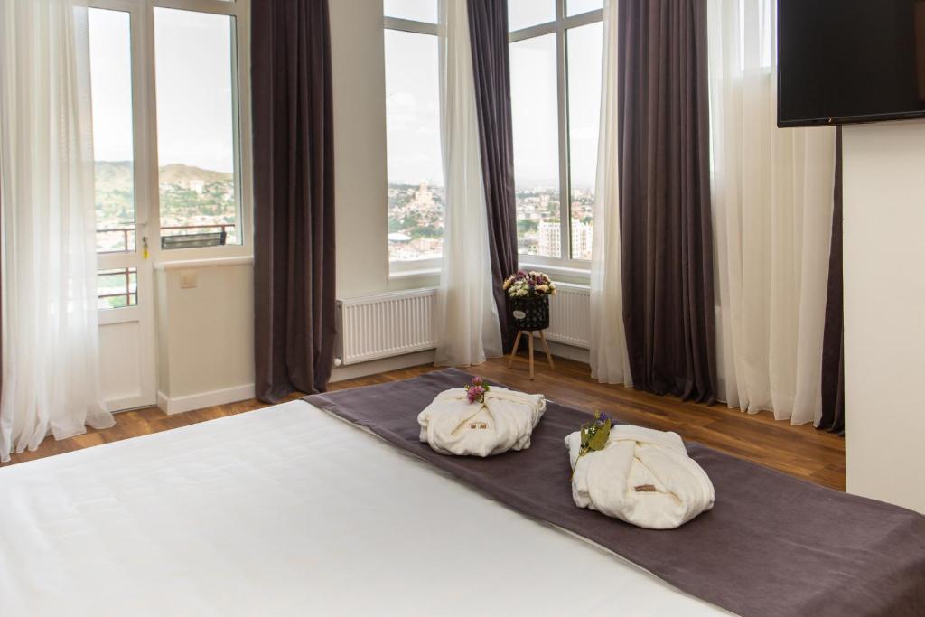 Postel nebo postele na pokoji v ubytování Vista Hotel