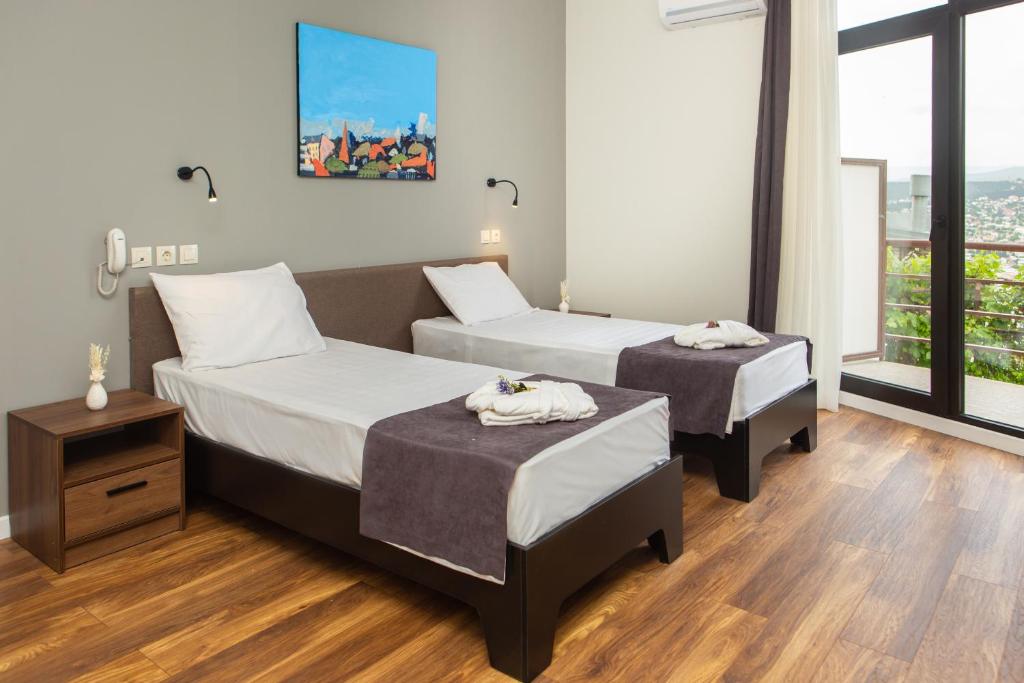 Postel nebo postele na pokoji v ubytování Vista Hotel