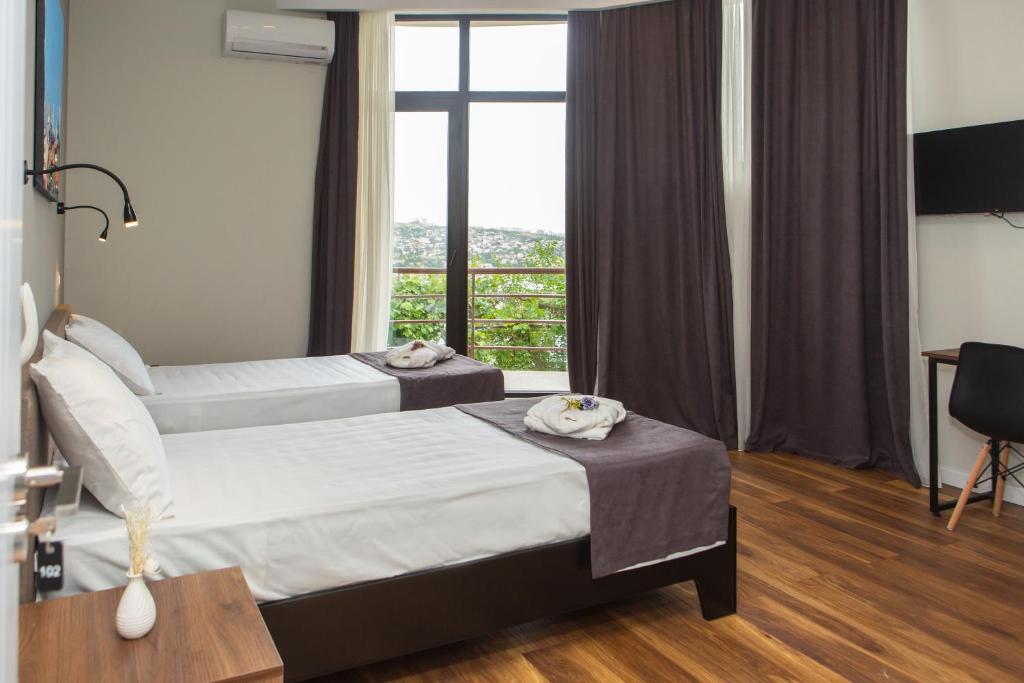 Postel nebo postele na pokoji v ubytování Vista Hotel