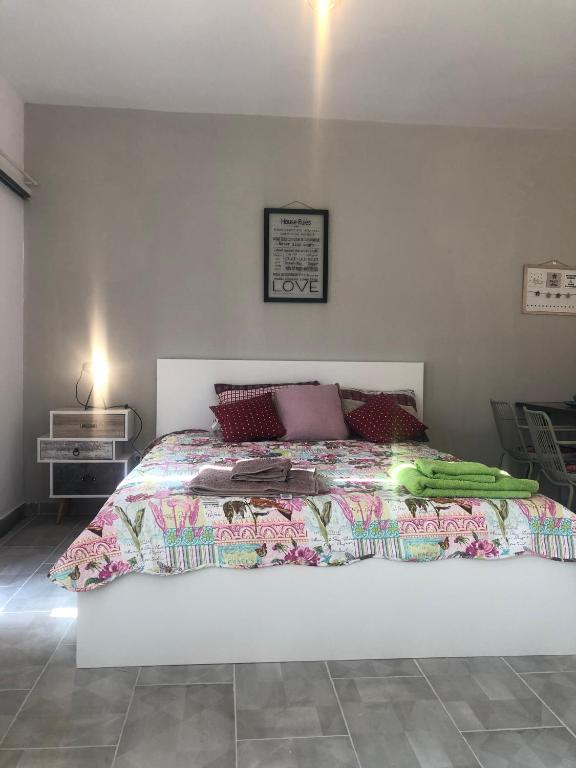a bedroom with a large white bed in a room at AgiaNapaNest studio in Ayia Napa