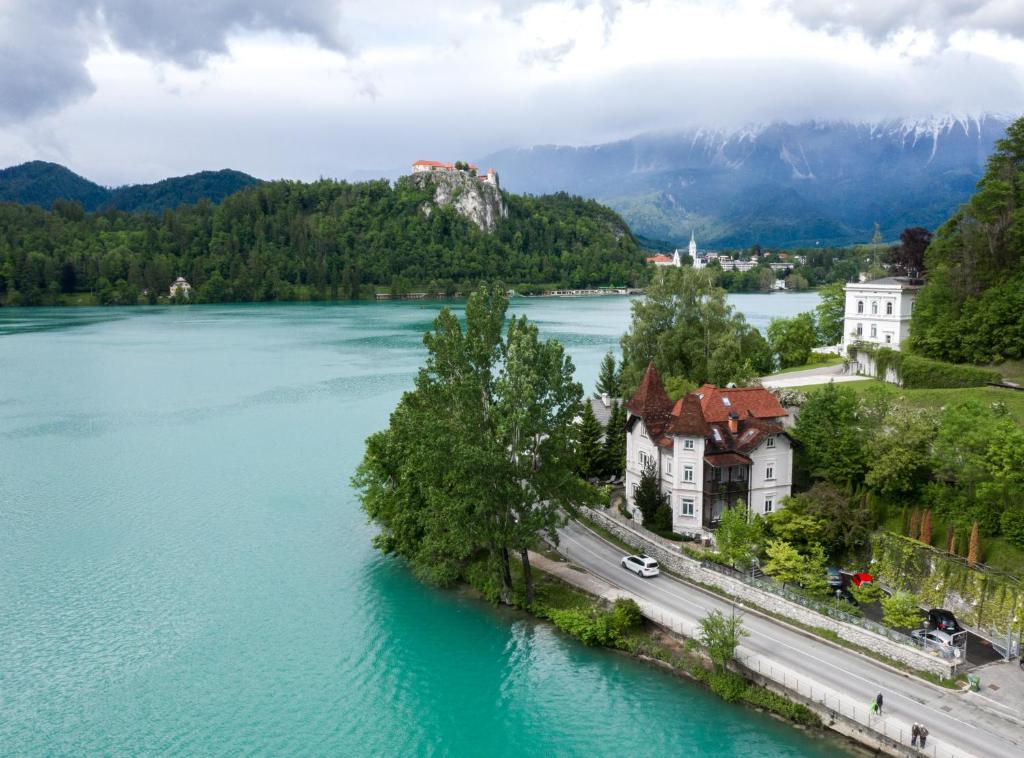an island in the middle of a large lake at Adora Luxury Hotel in Bled