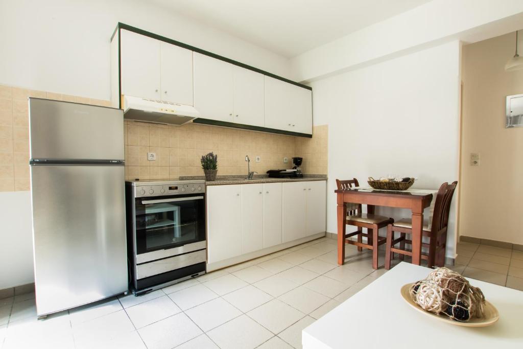 Kuchyň nebo kuchyňský kout v ubytování Kimata Apartments
