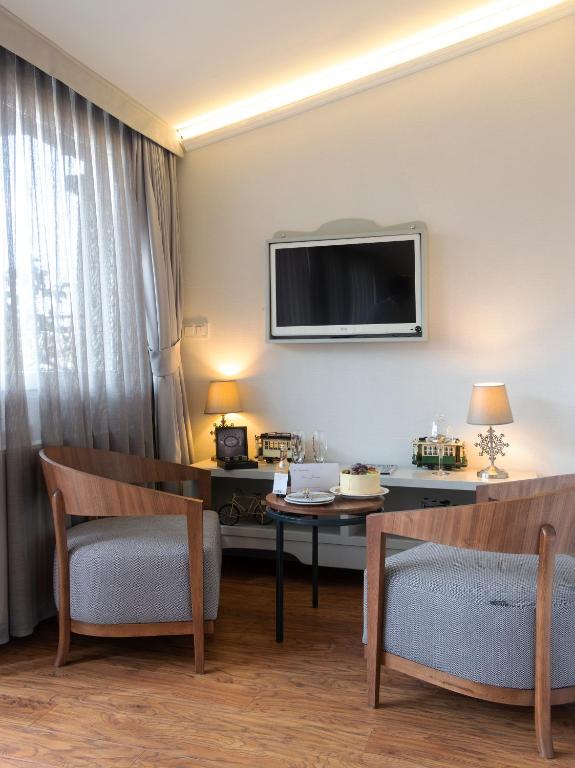 TV a/nebo společenská místnost v ubytování Louis Appartements Galata