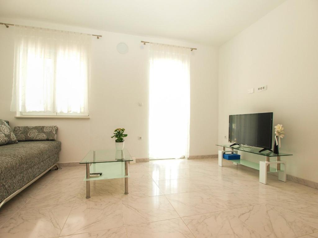 TV i/ili zabavni centar u objektu 4 Stars Apartments-Pikula