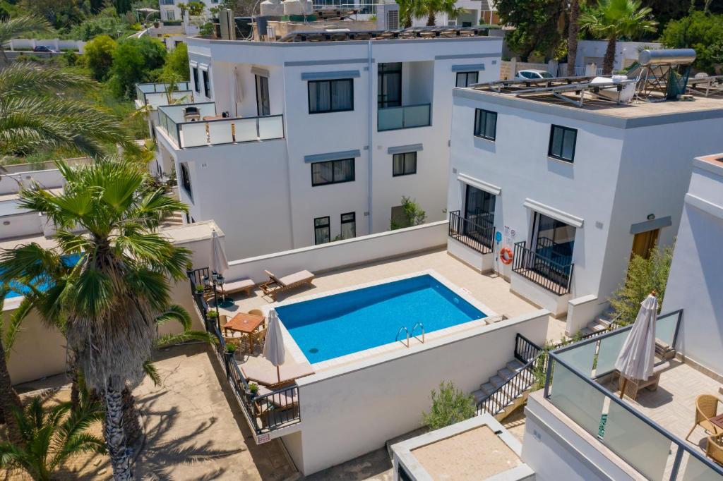 an aerial view of a house with a swimming pool at Baldacchino Holiday Villas in Mellieħa