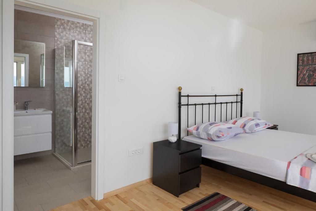 Posteľ alebo postele v izbe v ubytovaní Absolute Beach Villa