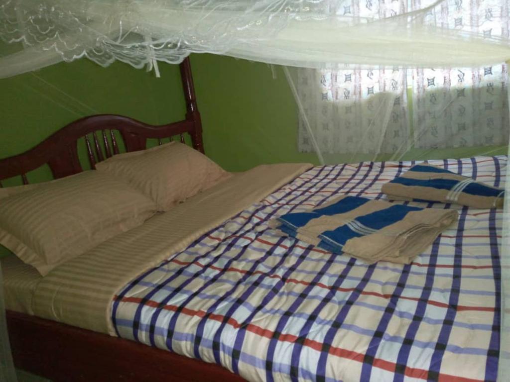Postel nebo postele na pokoji v ubytování Sipi Traveller's Lodge