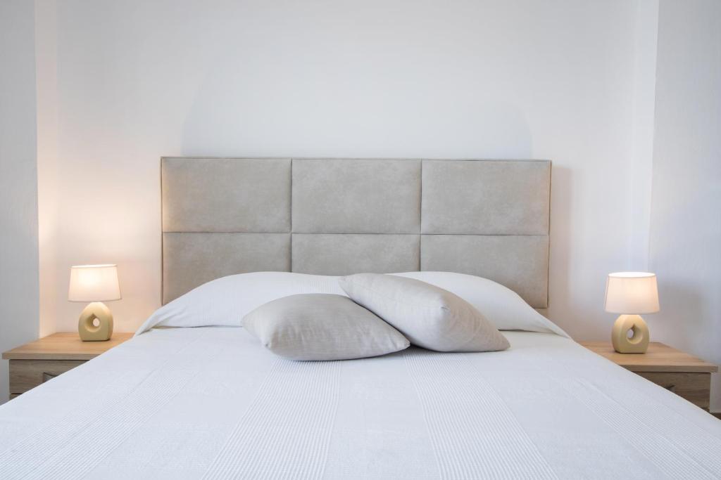 Postel nebo postele na pokoji v ubytování Kimata Apartments