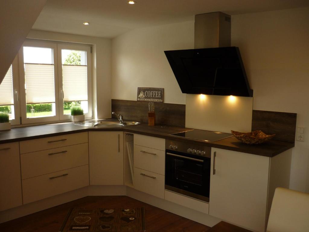 a kitchen with a sink and a stove top oven at Lucky Holiday I in Isny im Allgäu