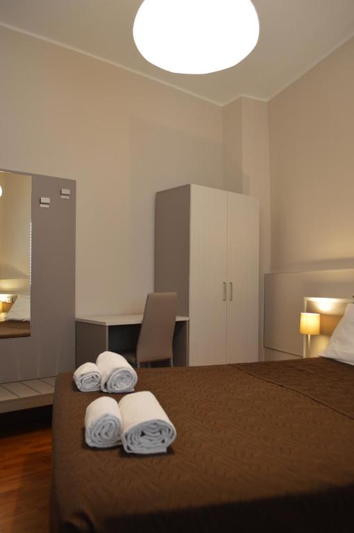 Postel nebo postele na pokoji v ubytování Hotel Arena