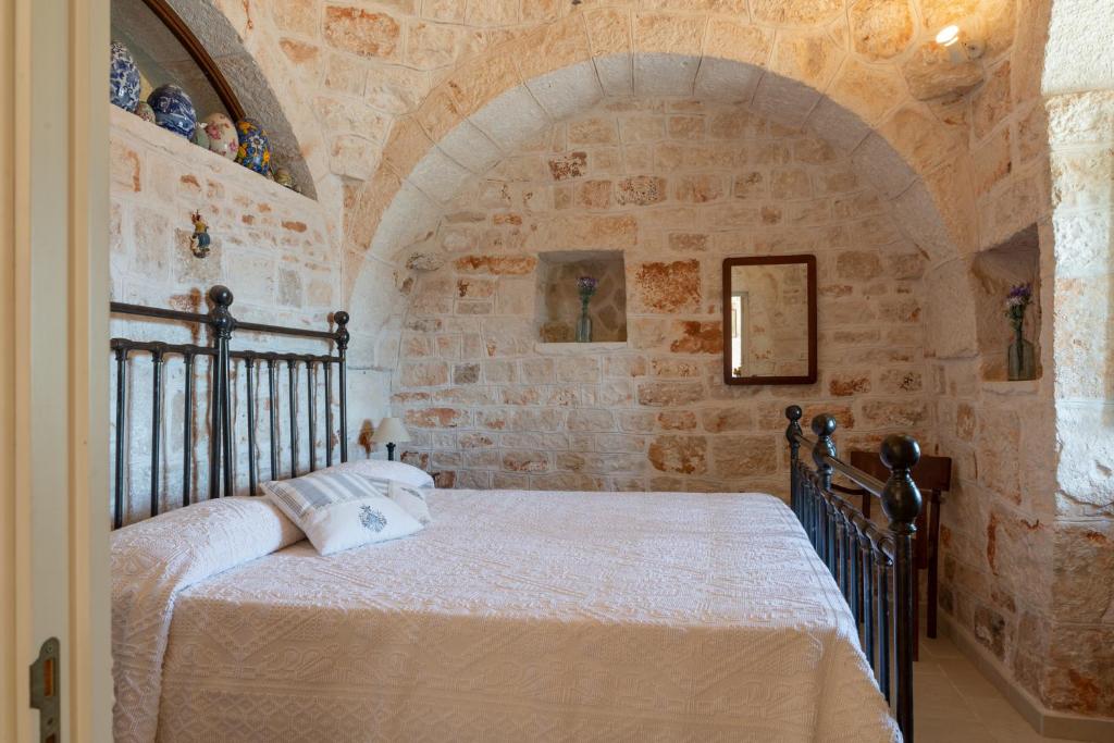 Posteľ alebo postele v izbe v ubytovaní Stile e relax nei trulli by Wonderful Italy