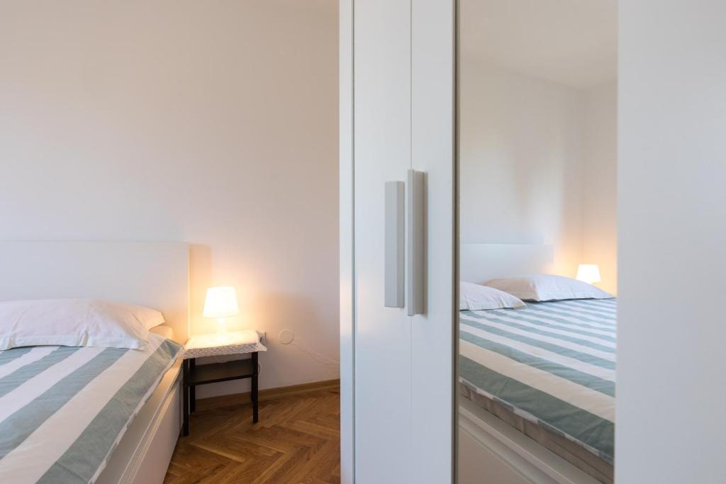 Postel nebo postele na pokoji v ubytování Seaside apartments