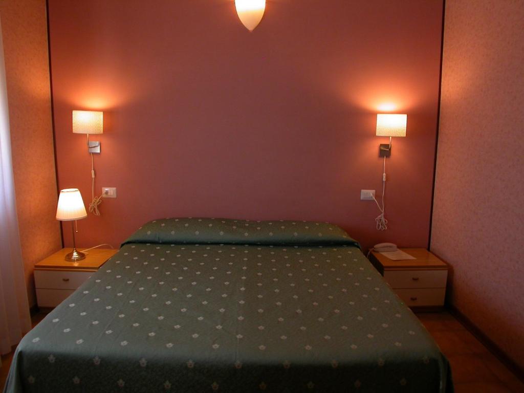 Postel nebo postele na pokoji v ubytování Hotel Il Roscio