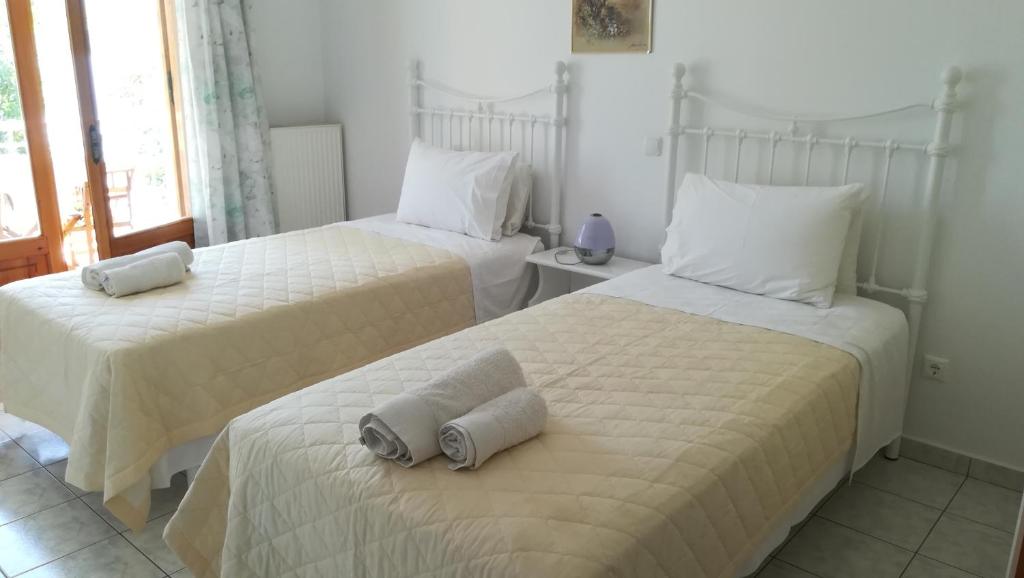 Postel nebo postele na pokoji v ubytování Tzeni Villa