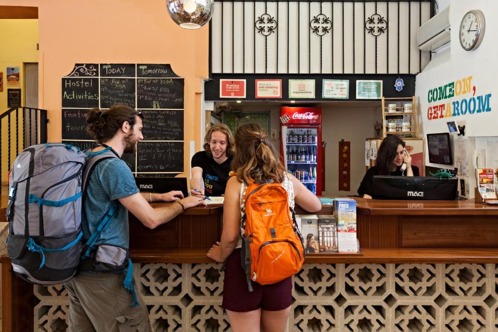 a group of people standing at a cash register at Abraham Jerusalem in Jerusalem