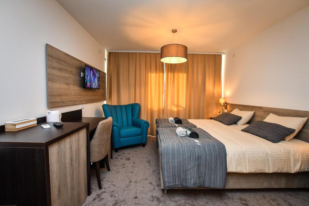 Postel nebo postele na pokoji v ubytování Miido Apartments