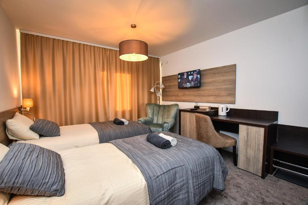 Postel nebo postele na pokoji v ubytování Miido Apartments