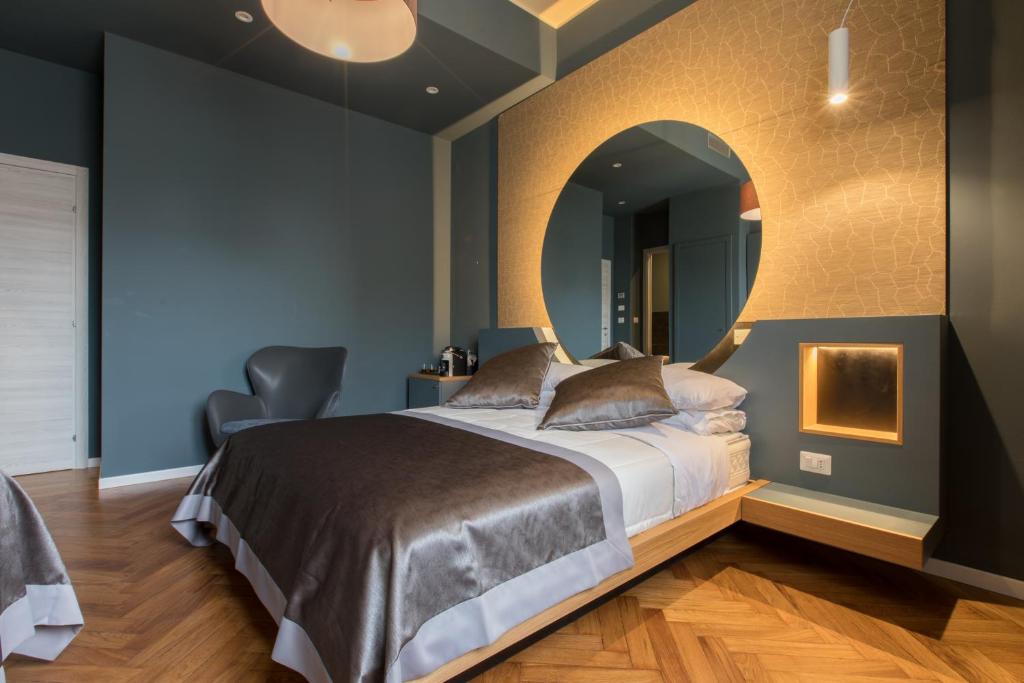 Кровать или кровати в номере Le Texture Premium Rooms Duomo-Cordusio