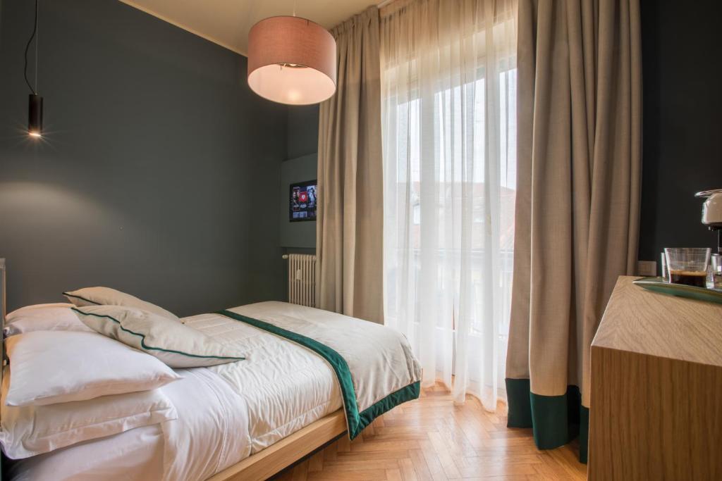 Кровать или кровати в номере Le Texture Premium Rooms Duomo-Cordusio