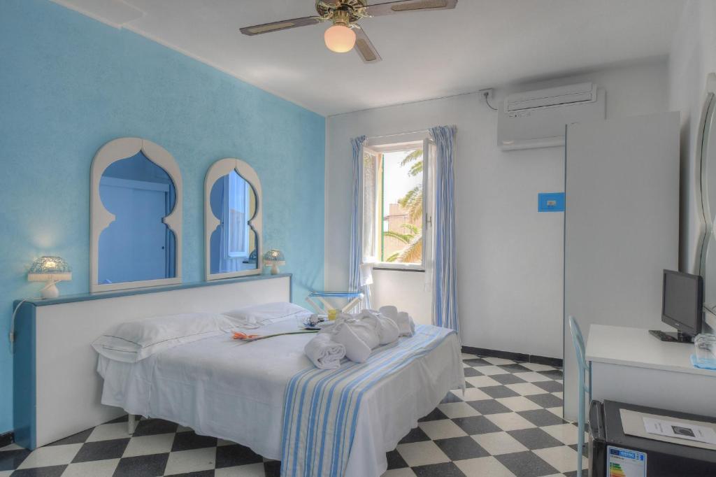 Posteľ alebo postele v izbe v ubytovaní Hotel Arabesque