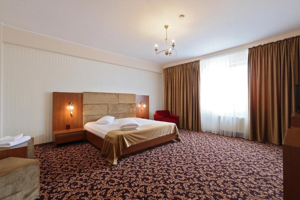 Postel nebo postele na pokoji v ubytování Hotel Impero
